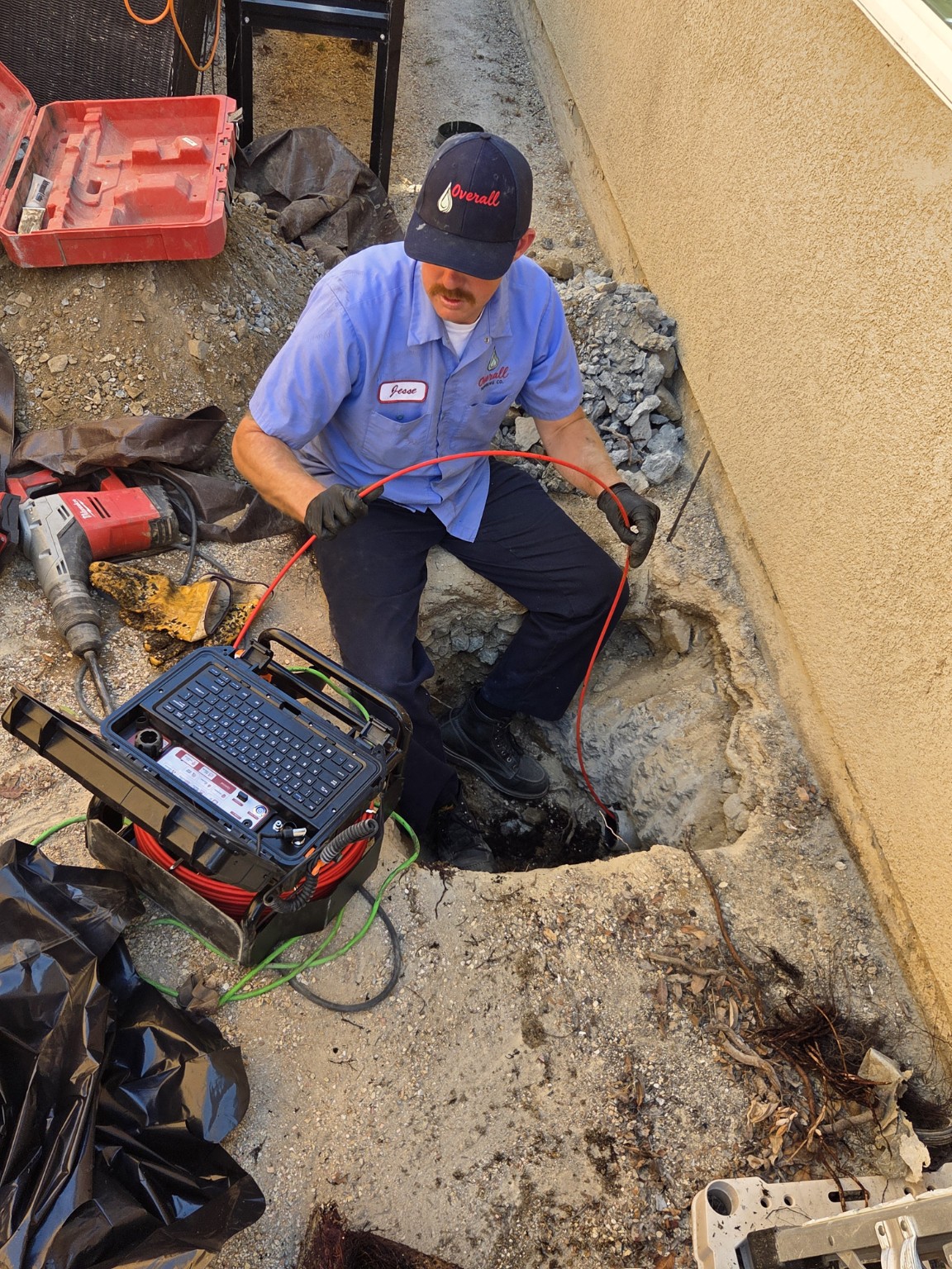 Overall Plumbing Co. technician performing a sewer camera inspection